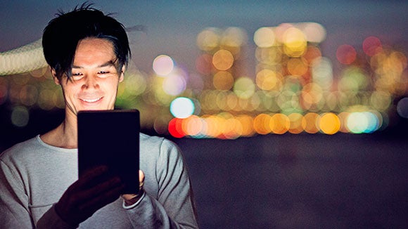 man benchmarking his salary on a tablet