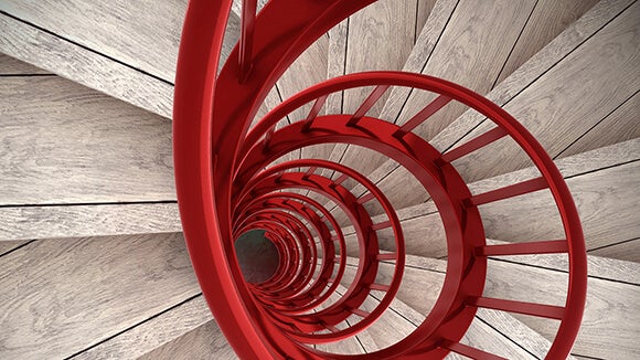 red spiral staircase with wooden steps